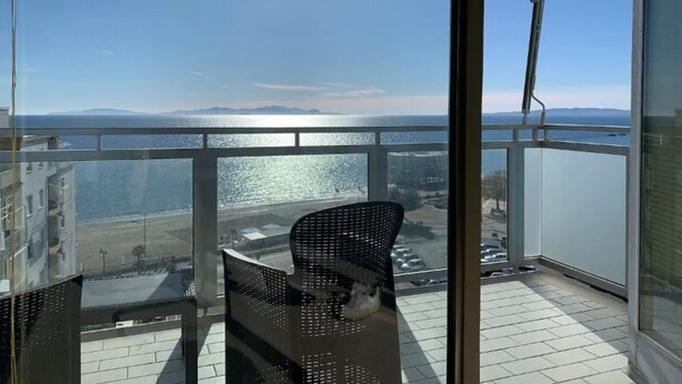 A balcony with a clear view of the sea and distant mountains. - TORRE AZZURRA - SUNSET (Follonica)