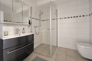Shower, hair dryer, towels, soap