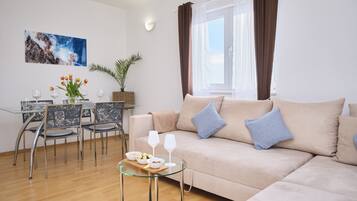 Apartment, Balcony, Sea View | Living area | Smart TV