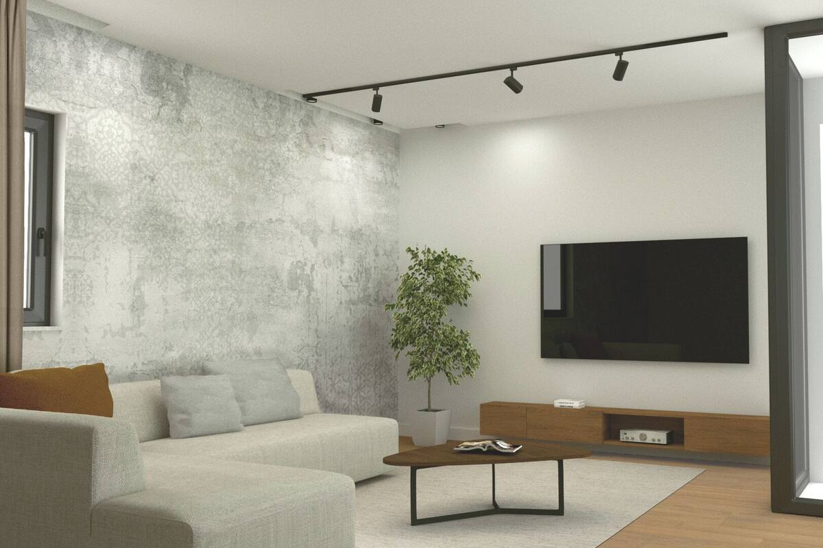 Una sala de estar moderna con pared gris texturizada, un sofá, una mesa de centro, una planta y un televisor de pantalla plana montado en la pared.