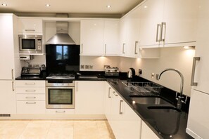 Private kitchen - Spacious dog friendly apartment by the beach, private garden and sea views. (Padstow)
