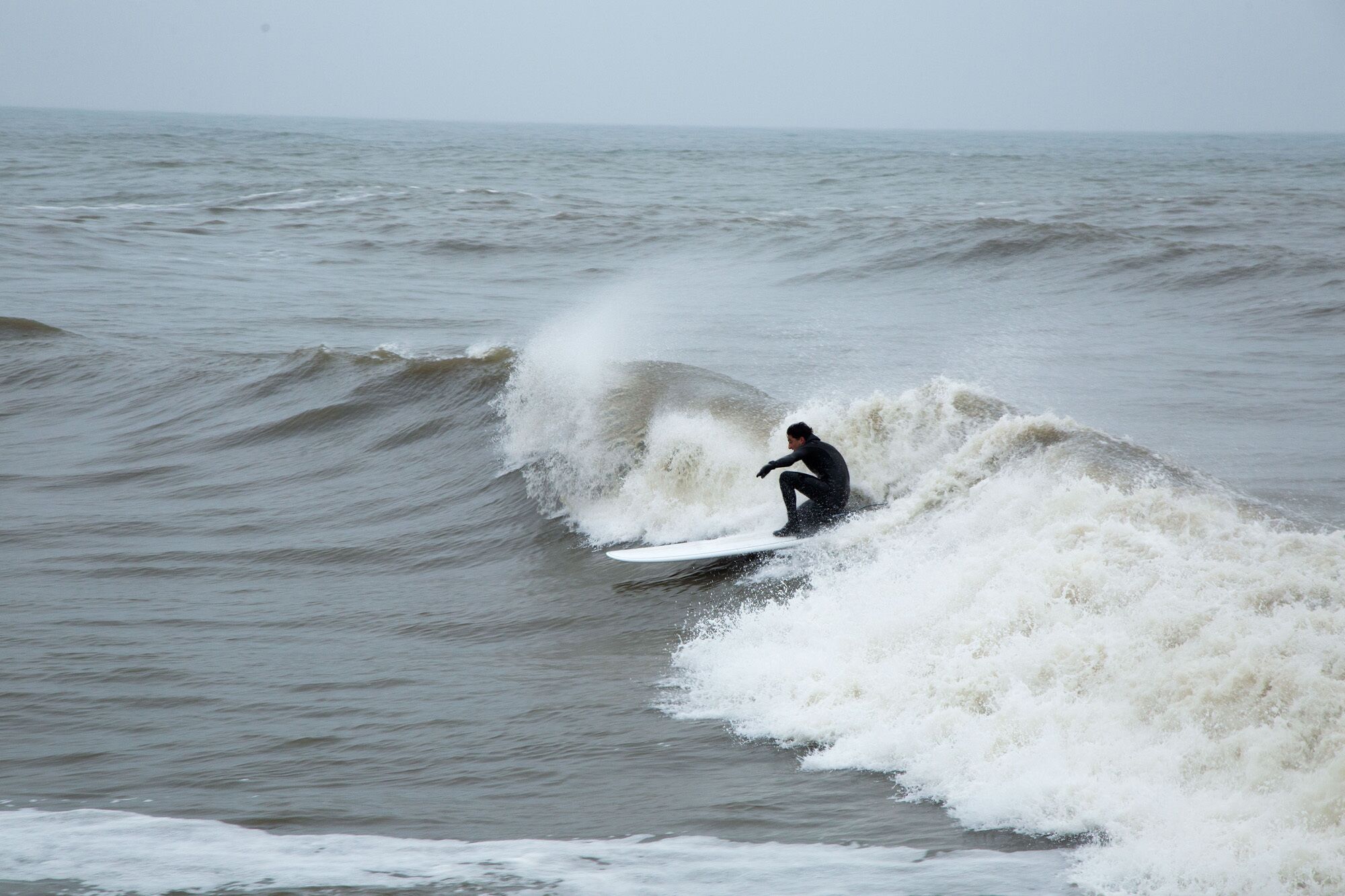 A person surfing on a wave.