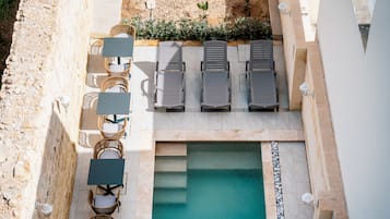 Outdoor pool, open 8:00 AM to 8:00 PM, pool umbrellas, sun loungers