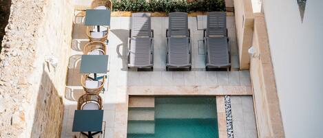 Outdoor pool, open 8:00 AM to 8:00 PM, pool umbrellas, pool loungers