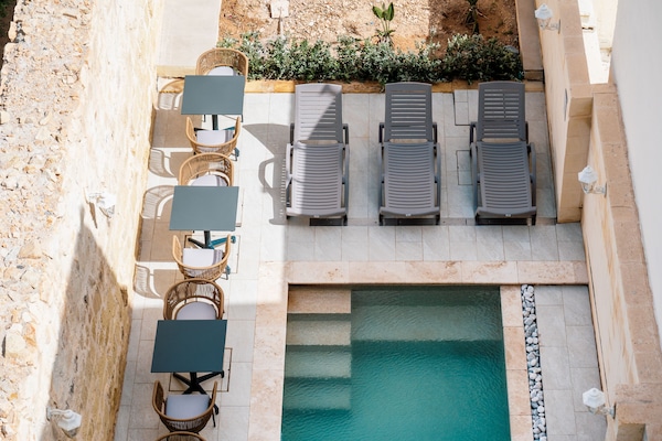 Outdoor pool, open 8:00 AM to 8:00 PM, pool umbrellas, pool loungers