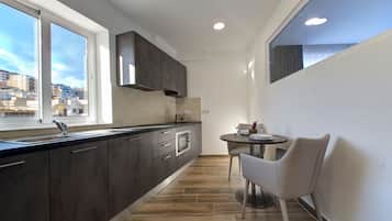 Superior Studio, Sea View, Terrace | In-room safe, desk, laptop workspace, iron/ironing board