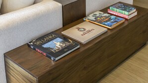 A modern living room with a sofa, a coffee table, and books. - W15 Glenfall Nuwara Eliya (Nuwara Eliya)