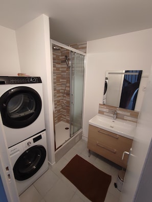 Shower, hair dryer, towels, soap