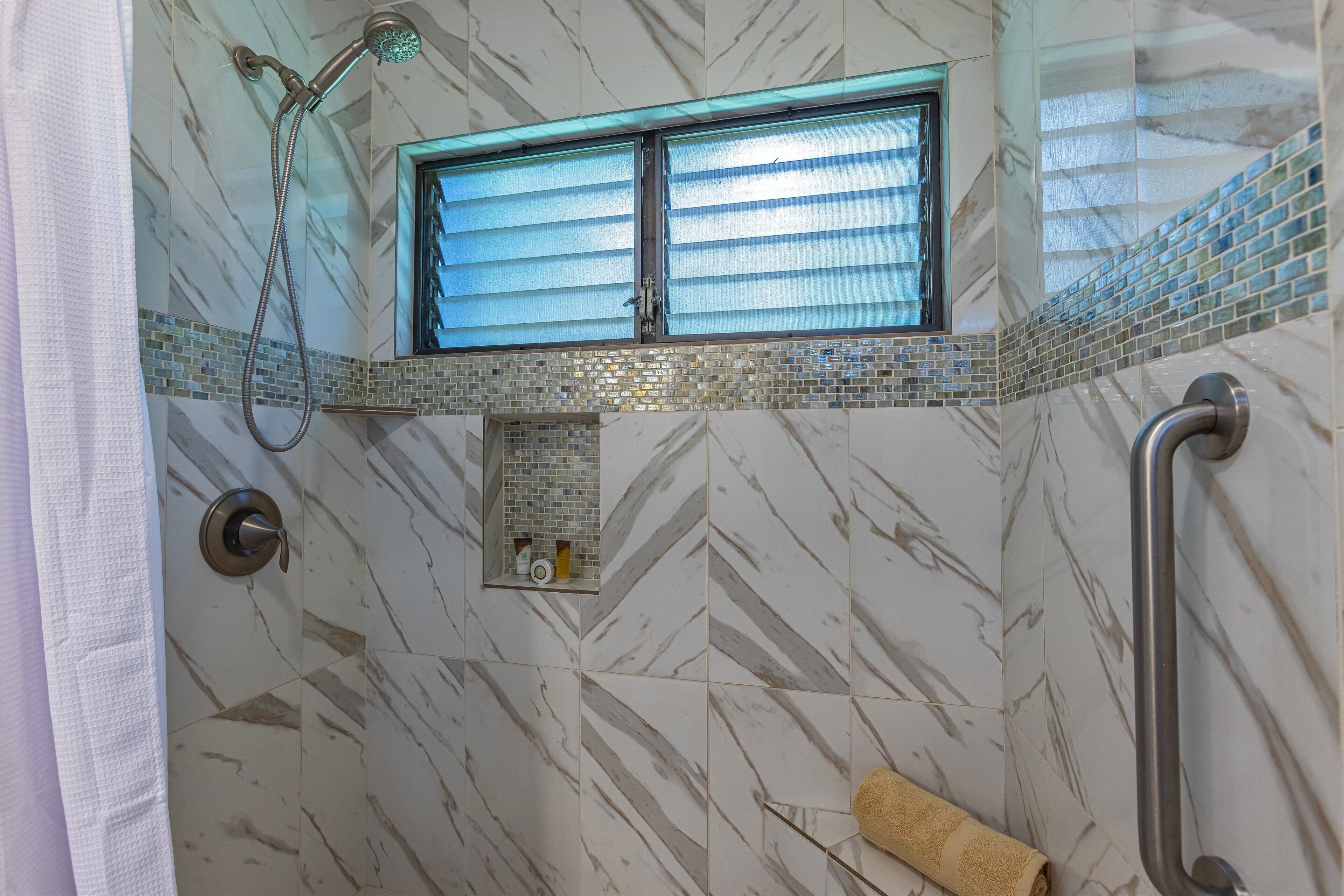 Shower, hair dryer, towels, shampoo