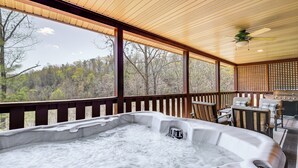 A hot tub with a view of a forest. - Cozy Sevierville Cabin w/ Hot Tub, Mountain Views! (Sevierville)