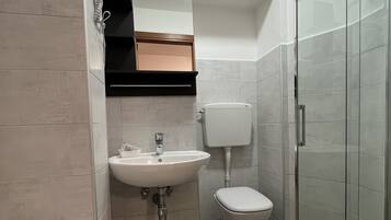 Shower, rainfall showerhead, bidet, towels