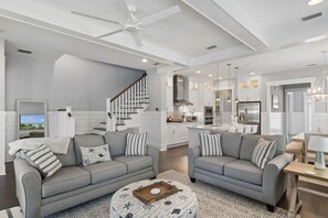 A spacious living area with a grey sofa set, a wooden coffee table, and a patterned rug. - 3,000+ Sq Ft! Golf Cart & 6 Bikes! Walk to 2 Pools! 3 King Suites and Bunk Room! ~ Unwined at Naturewalk on 30A (Santa Rosa Beach)