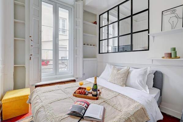 1 bedroom, desk, iron/ironing board, travel crib