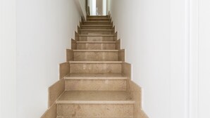 A staircase with a handrail and a light fixture at the top. - 3852 Dolly House - Primo Piano by Barbarhouse (Porto Cesareo)
