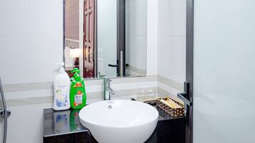 Family Room, City View | Bathroom | Shower, hydromassage showerhead, designer toiletries, hair dryer