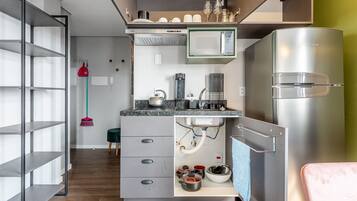 Fridge, microwave, coffee/tea maker, cookware/dishes/utensils