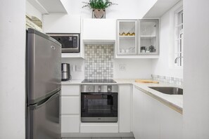 Fridge, microwave, oven, cookware/dishes/utensils