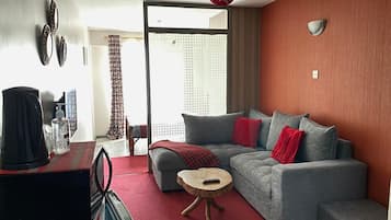 Deluxe Studio | Living area | 24-inch Smart TV with digital channels