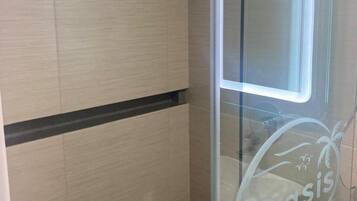 Business Room | Bathroom | Shower, hair dryer, towels, soap