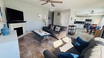 Smart TV, fireplace, table football, books