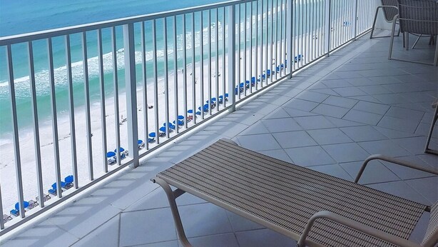 A balcony with a view of the beach and ocean. - 1204 - Free Beach Chairs and Amenity Package! (Panama City Beach)