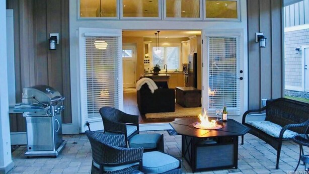 A covered patio with outdoor furniture, a grill, and a fire pit. - Qualicum Family Cottage - 3bd/2 bath (Qualicum Beach)