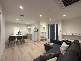 Premium Apartment | Living area | 43-inch Smart TV with cable channels