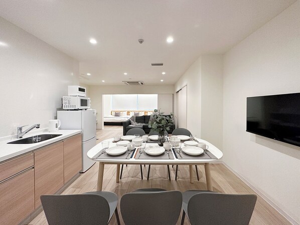 Premium Apartment | Living area | 43-inch Smart TV with cable channels