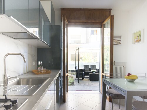 Elegant and spacious apartment with private garden and garage near the sea.