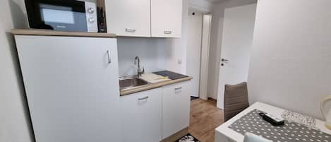 Fridge, microwave, cookware/dishes/utensils