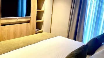 Ropa de cama de alta calidad, minibar, caja fuerte