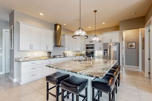 Fridge, microwave, oven, stovetop - Open home with heated pool, dock, grill, beach gear, smart TVs, W/D, & AC (Cape Coral)