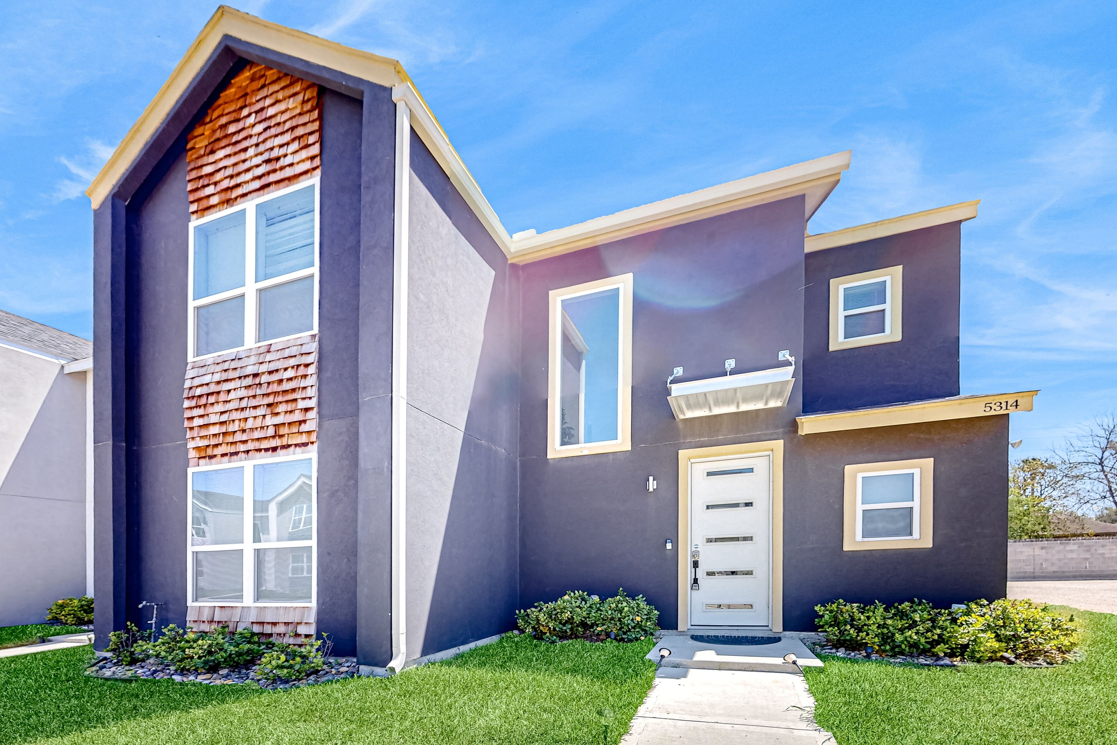 New two-story dog-friendly home with sunny patio, streaming, washer/dryer, & AC