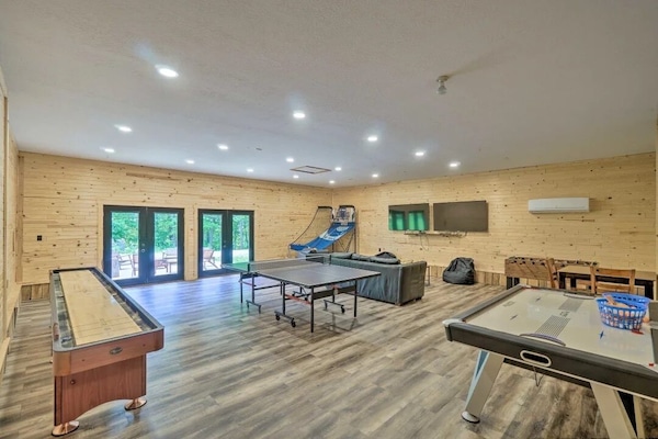 Fun awaits in our spacious game room complete with a ping pong table, air hockey, a shuffleboard table, pop a shot, and comfortable lounge areas, opening up to a sunny patio for endless entertainment.