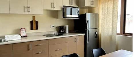 Fridge, microwave, stovetop, coffee/tea maker