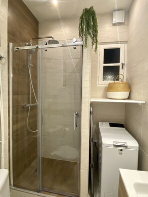 Shower, hair dryer, towels, soap