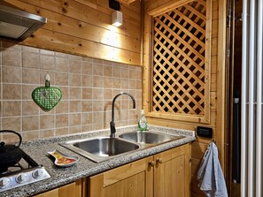 Fridge, stovetop, cookware/dishes/utensils, spices