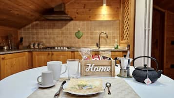 Fridge, stovetop, cookware/dishes/utensils, spices