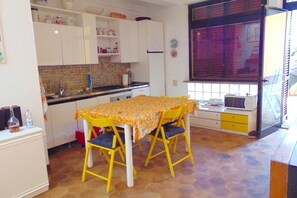 Fridge, oven, dishwasher, dining tables