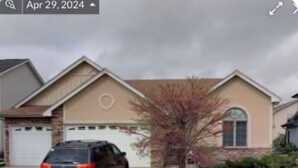 A residential house with a garage, a driveway, and a tree in the front yard. - Hello guests, welcome to our ranch house in a quiet neighborhood. (Urbandale)