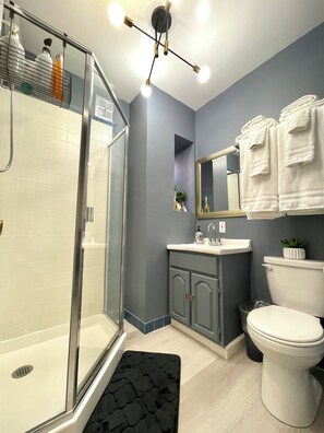 Shower, hair dryer, towels, soap