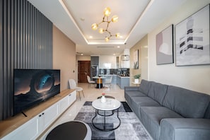 Presidential Suite, 2 Bedrooms, Connecting Rooms, City View | Living area | 65-inch Smart TV with cable channels, Netflix, smart speakers - Kotrip Madison Saigon Luxury  (Ho Chi Minh City)
