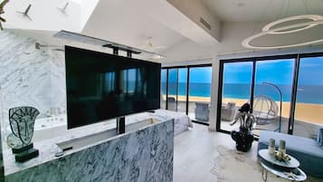 Honeymoon Condo | Living area | 50-inch Smart TV with digital channels, Netflix, streaming services