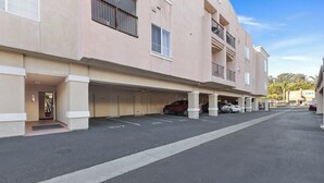 A multi-story parking garage with several cars parked.