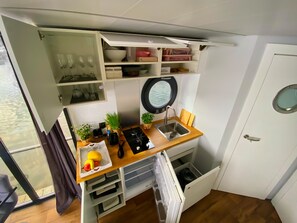 Fridge, stovetop, coffee/tea maker, cookware/dishes/utensils