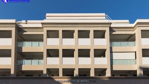 A multi-story building with a modern architectural design, featuring a series of balconies and large windows. - Rhodes Central Suite (Rhodes)