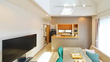 Family Apartment | Living area | 50-inch flat-screen TV with cable channels, streaming services