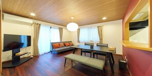 Basic Apartment | Living area | 50-inch flat-screen TV with cable channels, streaming services