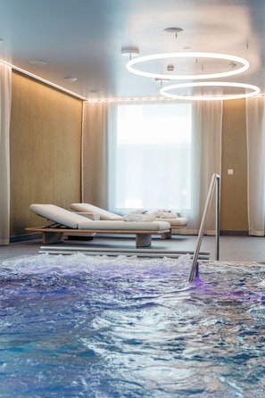 Indoor pool, open 7:00 AM to 10:00 PM, pool loungers