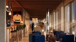 A modern lobby with a bar area, seating, and a large window providing natural light. - Residenza Du Lac (Paradiso)